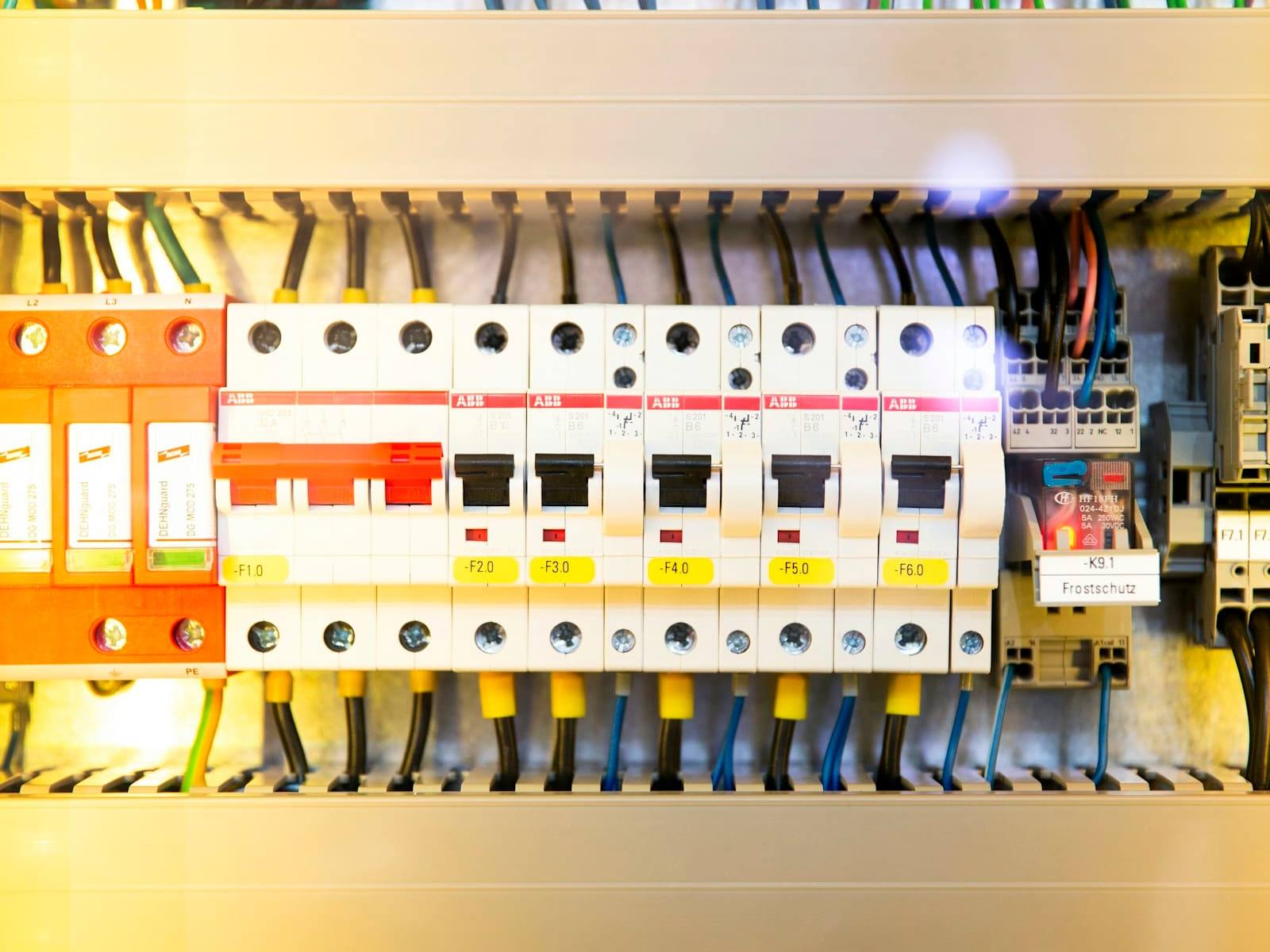 Neatly wired switchboard with a row of circuit breakers