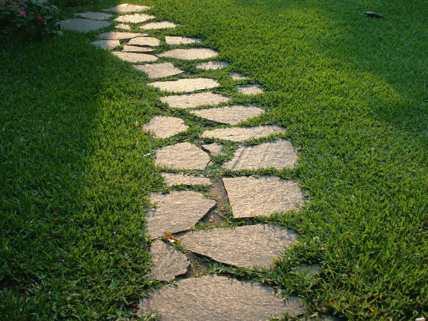 Sandstone stepping stones set into a green lawn